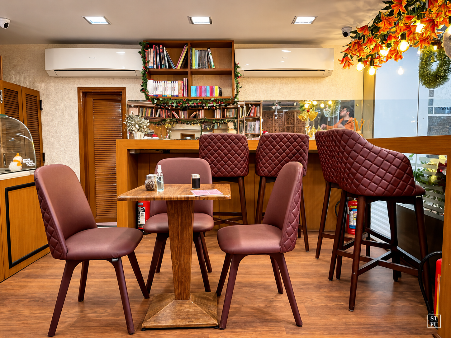 Seating and bookshelves at Too Mikkii Tapas South Extension